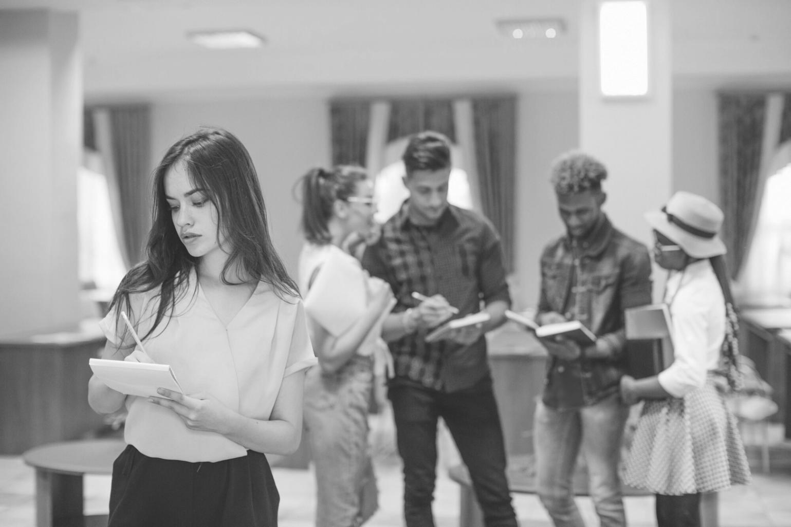 Diverse group of professionals collaborating on financial planning in modern workspace